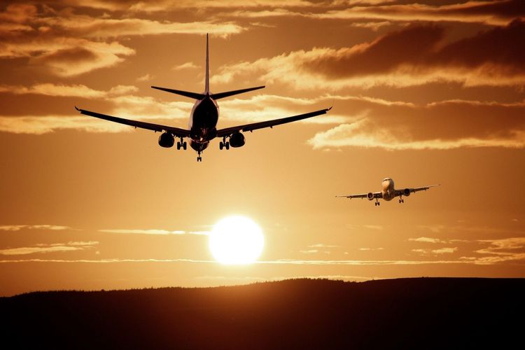 Planes flying during sunset