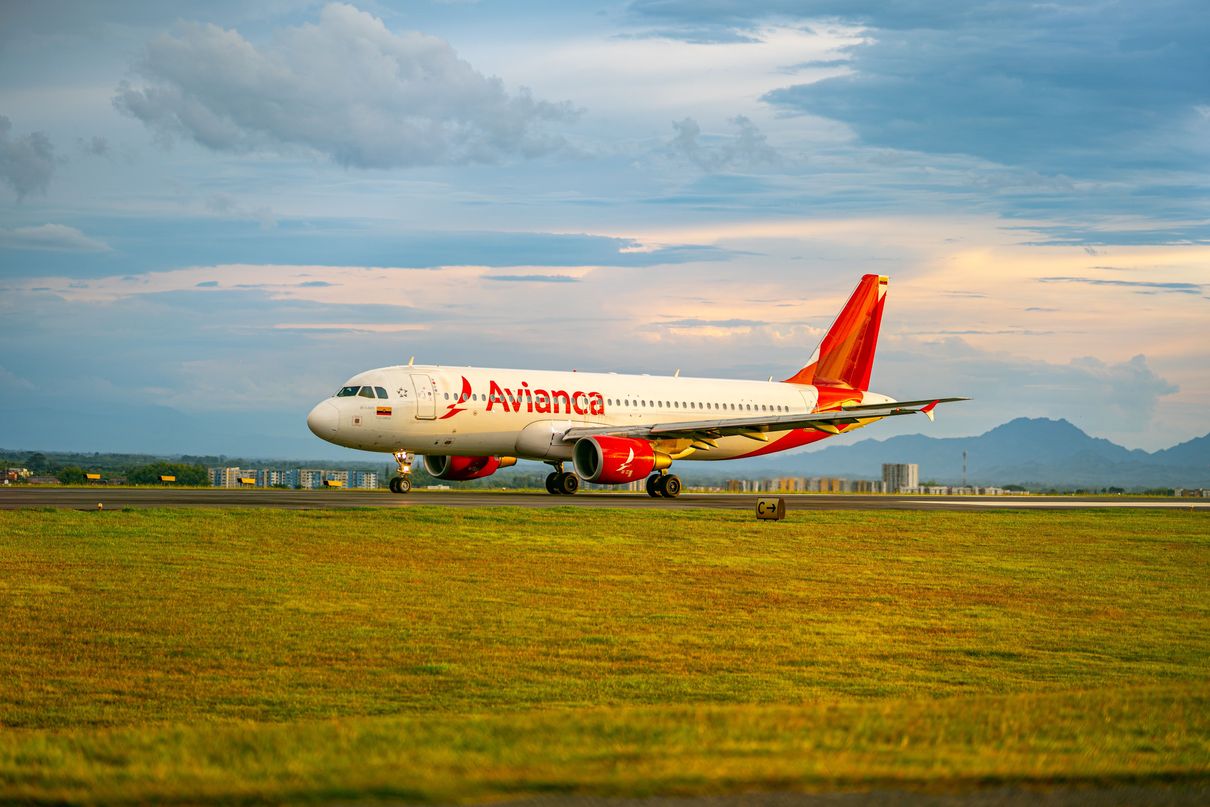 a large jetliner sitting on a top of an airport runway