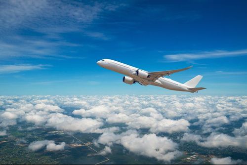 Airplane flying through the sky