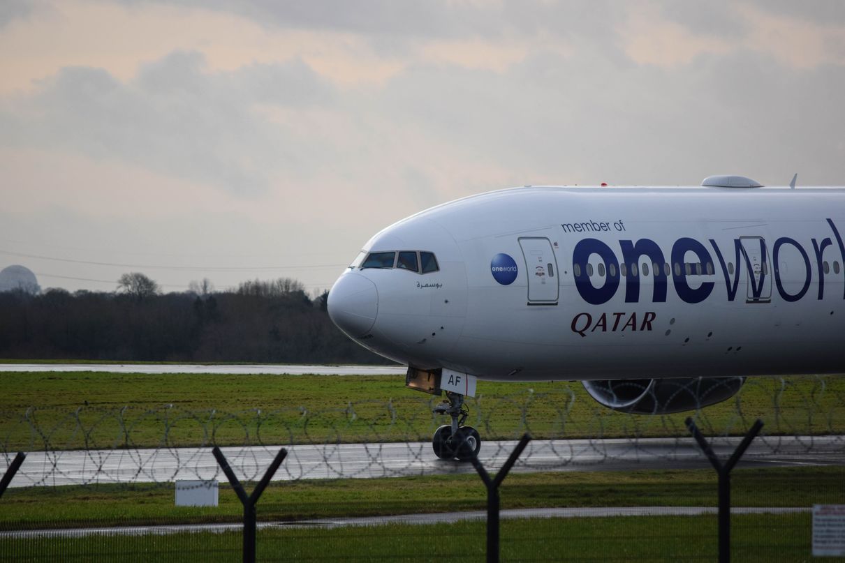 A large white airplane on a run way