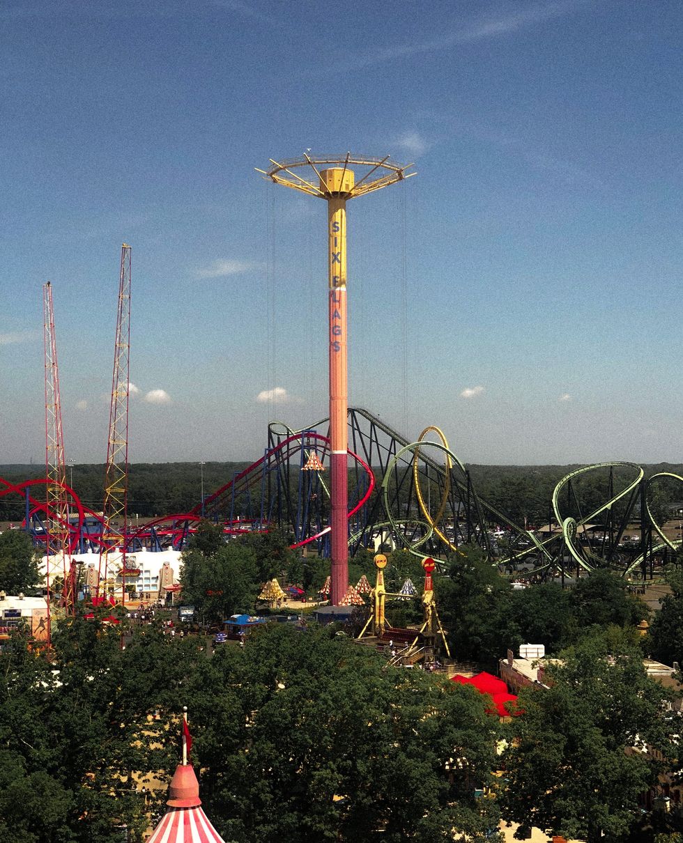 amusement park with ferris wheel and rides